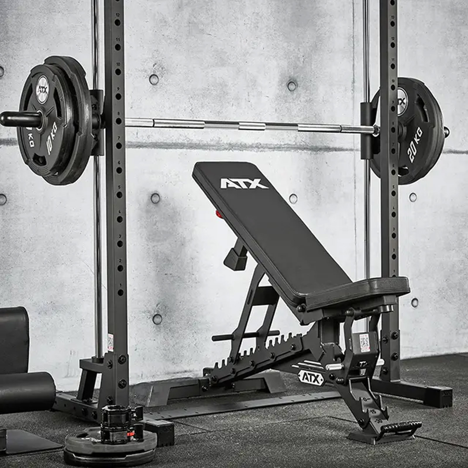 ATX Smith Machine 500 set up with an incline bench and weight plates