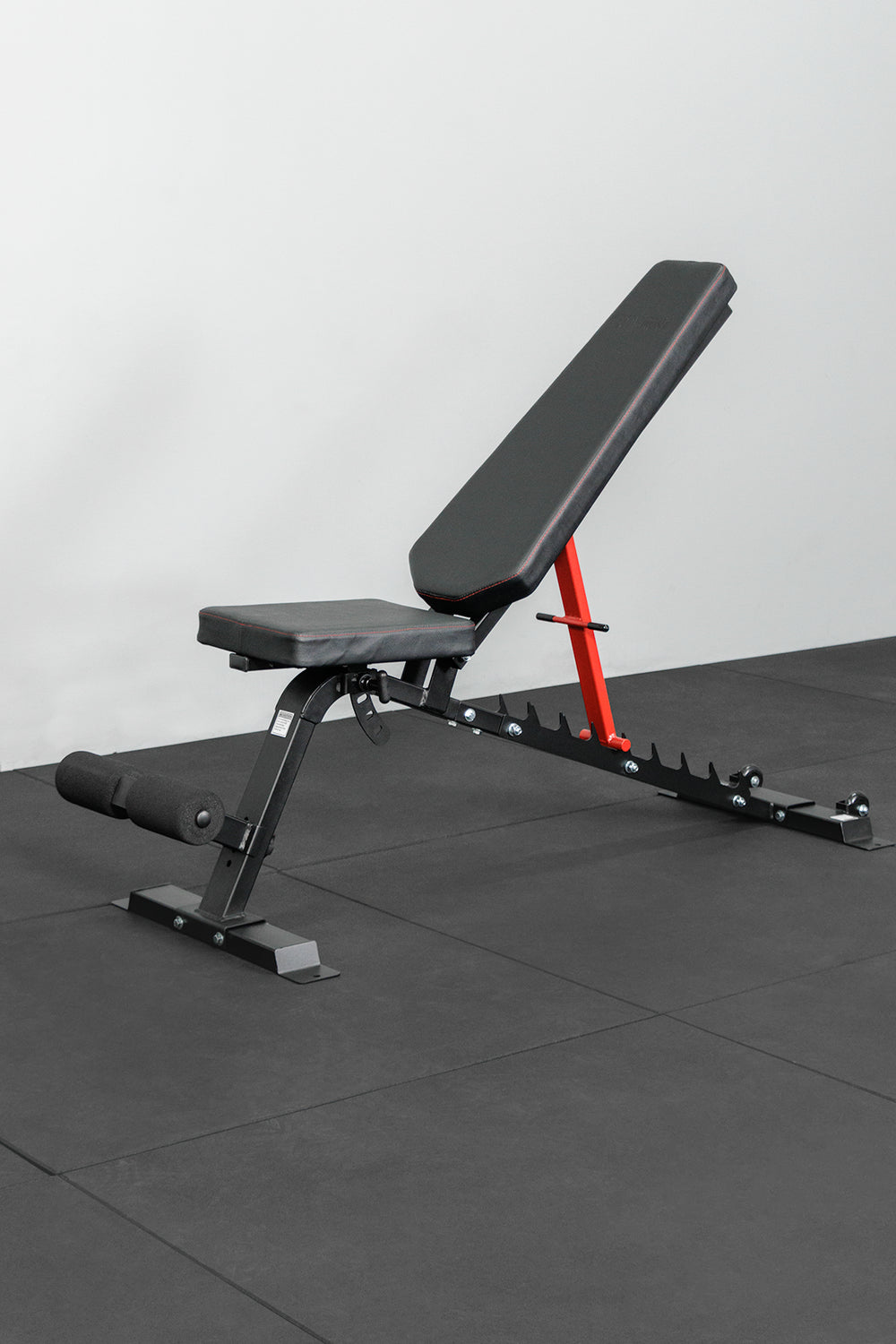 BodyIron Studio Utility FID bench with the backrest inclined and leg stabiliser attached